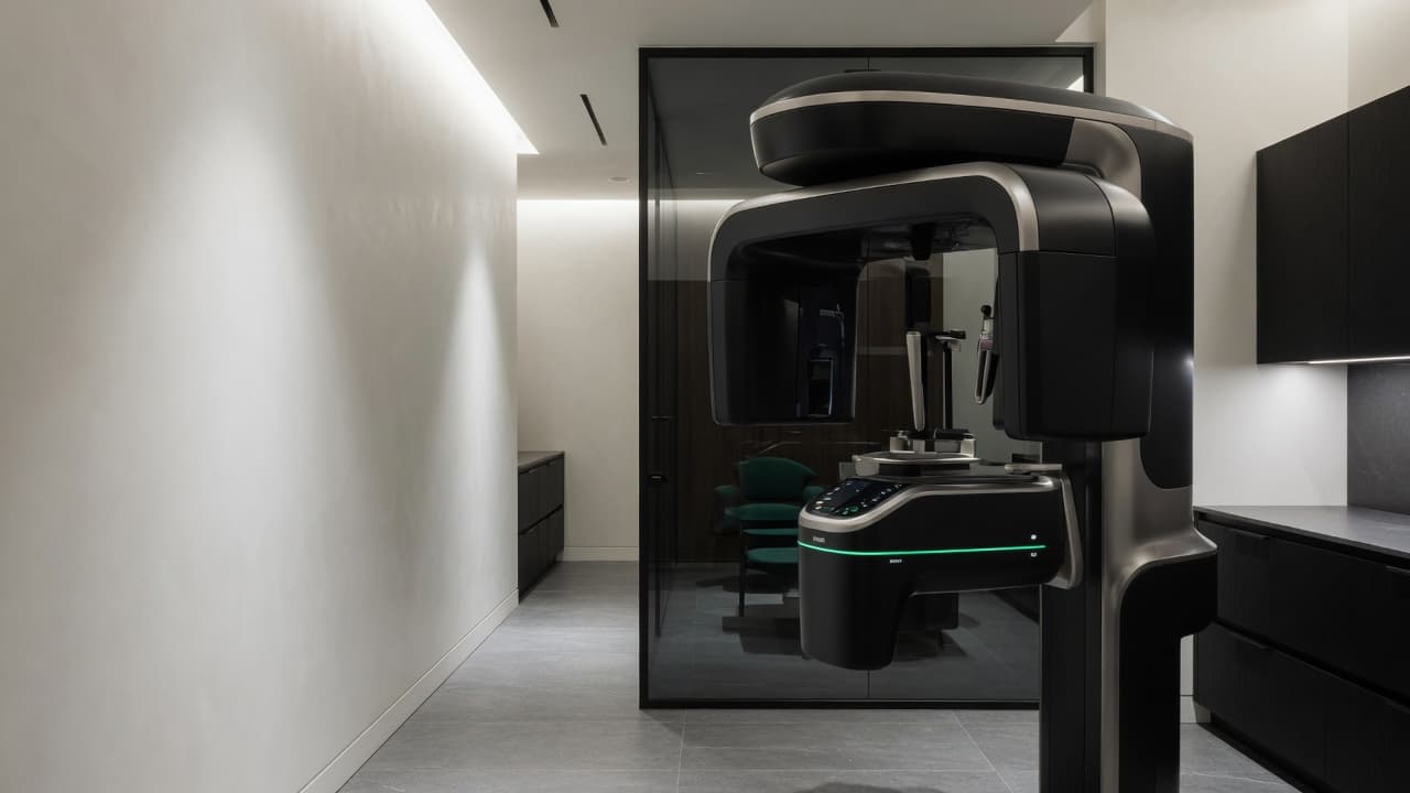 Advanced dental imaging equipment in a modern treatment suite